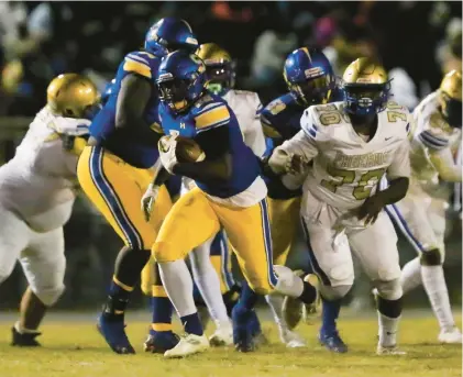  ?? STAFF ?? Oscar Smith’s Kevon King finds running room against Phoebus during a high school football game last season. Both teams went on to capture state titles. They will meet to conclude the regular season this year.