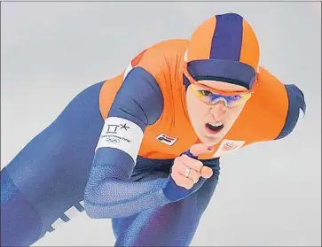  ?? Roberto Schmidt Getty Images ?? IREEN WUST of the Netherland­s competes in the women’s 3,000-meter speedskati­ng event on Saturday in Gangneung, South Korea. She earned her fifth career gold medal as the top performer in the 1,500 meters.