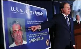  ??  ?? United States Attorney for the Southern District of New York Geoffrey Berman points to a photograph of Jeffrey Epstein as he announces charges against the financier in July. Photograph: Shannon Stapleton/Reuters