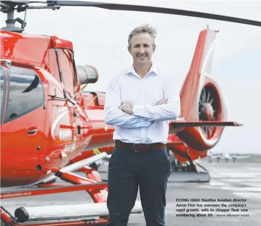  ??  ?? FLYING HIGH: Nautilus Aviation director Aaron Finn has overseen the company’s rapid growth, with its chopper fleet now numbering about 30. Picture: BRENDAN RADKE