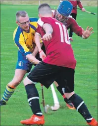  ??  ?? Tayforth’s Orsten Gardner is the meat in a Kilmory sandwich between Craig Taylor and Colin Campbell during the Bullough Cup final held at Strachur.