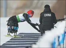  ??  ?? Shan Yilin uses skis designed at Tsinghua University in Beijing.