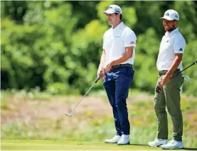  ?? ANDREW WEVERS/USA TODAY SPORTS ?? Xander Schauffele, left, and Patrick Cantlay wait to putt on the fifth green during the first round of the 2023 Zurich Classic of New Orleans.