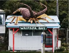  ??  ?? From left, Genevieve King serves road workers from her food truck in Clarence, just north of the road closure; the author surfs alone at a right-hand point near Kekerengu, just north of the road closure; Waipapa Bay Camping and Crayfish gathers dust in...