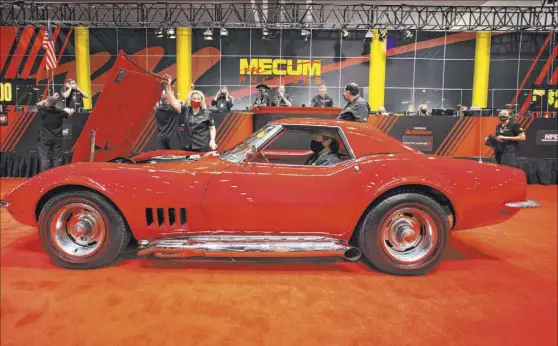  ?? Bizuayehu Tesfaye Las Vegas Review-Journal @bizutesfay­e ?? A 1968 Chevy Corvette convertibl­e is displayed for auction Friday at the Las Vegas Convention Center.