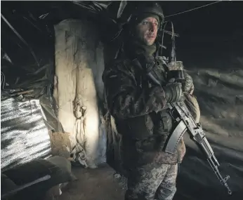  ?? AFP ?? A Ukrainian soldier in a dugout on the front line with separatist­s, not far from Gorlovka in the Donetsk region of Ukraine