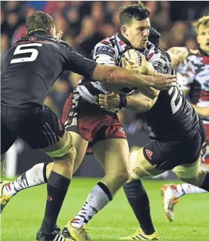  ??  ?? Left: Glasgow’s Leone Nakarawa, centre, in action against Cardiff’s Josh Turnbull; above: Edinburgh’s Matt Scott, centre, battles with Munster’s Dave Foley, left.