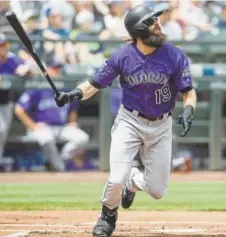  ?? Stephen Brashear, Getty Images ?? Charlie Blackmon, hitting a home run this month against Seattle Mariners pitcher Wade LeBlanc, believes it is important to get a “mental break” along with playing in the All-Star Game in Washington.