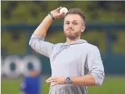  ?? GREG SORBER/JOURNAL ?? Former La Cueva High School and UCLA basketball star Bryce Alford throws out the first pitch before the Isotopes game against Iowa Monday.