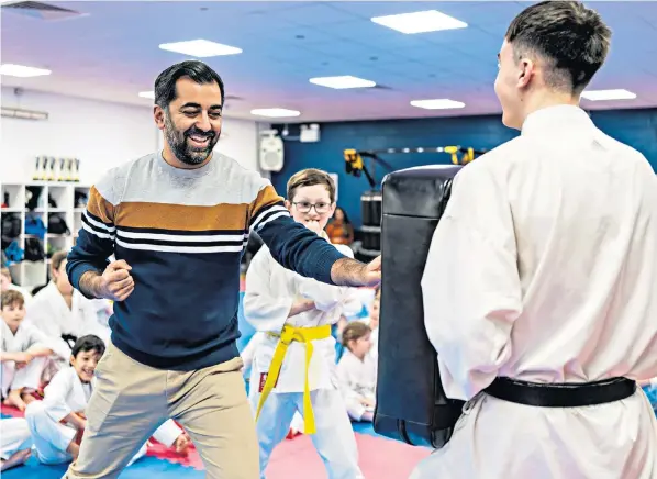  ?? ?? Humza Yousaf on Saturday at his ‘first karate lesson’ at Kanzen Karate, a martial arts school in Dundee. There are claims that he has kicked the taxpayer in the teeth by financing United Nations Relief and Works Agency