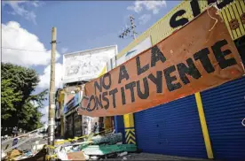  ?? ARIANA CUBILLOS / AP ?? A banner that reads in Spanish “No to the Constituen­t Assembly” is seen at the Petare neighborho­od in Caracas, Venezuela, on Saturday. Opposition leaders had called for a boycott of the vote, declaring it rigged for the ruling party.