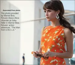  ?? Associated Press photo ?? This photo provided by Warner Bros. Pictures shows Alicia Vikander as Gaby Teller in Warner Bros. Pictures’ action adventure “The Man from U.N.C.L.E.”