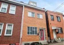 ?? ?? 360 Captures The brick row house at 121 S.11th St. on the South Side is priced at $249,000.