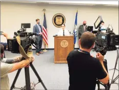  ?? Ben Lambert / Hearst Connecticu­t Media ?? New Haven Interim Police Chief Renee Dominguez and Mayor Justin Elicker give their weekly briefing on gun violence and policing matters in New Haven on Wednesday.