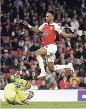  ?? AP ?? Vorskla’s keeper Bogdan Shust catches the ball in front of Arsenal’s Pierre-Emerick Aubameyang during the Europa League Group E match between Arsenal and Vorskla in London, England, yesterday.