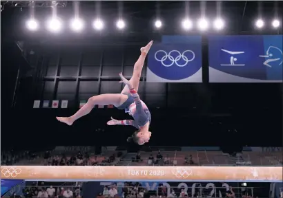  ?? JAMIE SQUIRE — GETTY IMAGES ?? Sunisa Lee competes on the balance beam during the women’s all-around competitio­n at the Tokyo Olympic Games on Thursday.