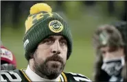  ?? MORRY GASH — THE ASSOCIATED PRESS ?? Packers quarterbac­k Aaron Rodgers walks off the field after his team lose the NFC championsh­ip to the Buccaneers.