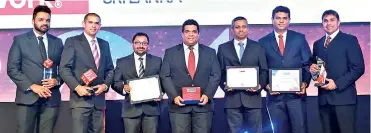  ??  ?? From left: DHL HR Specialist Wajira Senanayake, Finance Director Anton Perera, Human Resources Head Tharaka De Silva, Country Manager Dimithri Perera, Operations Director Sugath Jayawickra­ma, IT Head Vajira Bandara and Commercial Director Mario De Silva with their awards