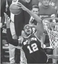  ?? EUROPEAN PRESS AGENCY ?? San Antonio’s LaMarcus Aldridge gets fouled while going for a rebound in the first half.