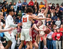  ?? PHOTOS BY ELLIOTT PORTILLO, HUMEDIA — FOR THE TIMES-STANDARD ?? McKinleyvi­lle senior Cody Whitmer is swamped by Arcata defenders during the Niclai championsh­ip game on Friday.