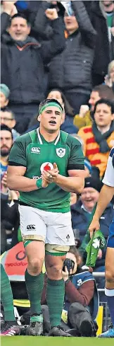  ??  ?? Joy unconfined: Ireland celebrate after Sean Cronin scores their bonus-point try against Scotland, before their title was confirmed by the result in Paris