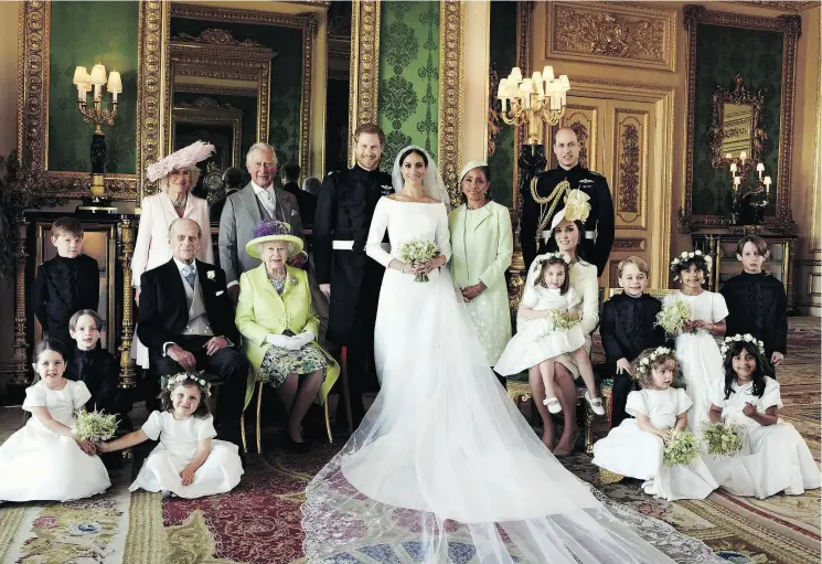  ?? ALEXI LUBOMIRSKI / AFP / THE DUKE AND DUCHESS OF SUSSEX ?? Prince Harry and Meghan Markle, now the Duke and Duchess of Sussex, pose with (back row, left to right) Prince Charles and his wife Camila, Doria Ragland, Meghan’s mother, Prince William, (middle row, left to right) Jasper Dyer, Prince Philip, Queen...