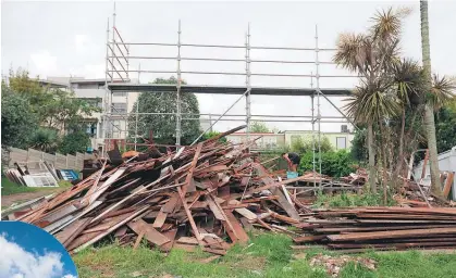  ?? Main picture / Doug Sherring ?? Here today, gone tomorrow: a few planks are all that remains of the 135-year-old cottage at 18 Paget St in Freemans Bay.