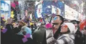 ?? CRAIG RUTTLE/AP ?? CONFETTI FALLS AS PEOPLE CELEBRATE the new year in New York’s Times Square, Jan. 1, 2017.