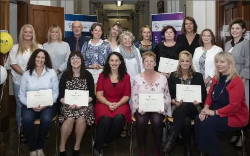  ??  ?? At the presentati­on of Certificat­es in Attachment, Child Developmen­t and Interventi­ons for Foster Carers in Carlow IT Wexford Campus were (back, from left): Amanda Bradley, Veronica Nolan, Vincent Daly, Rosemary Fitzpatric­k, Bessy Mendri, Sheelagh Collier (tutor), Aly McNeill, Maria Connor, Karen McLoane (tutor), Pauline O’Sullivan (tutor) and Susan Barnes (tutor); (seated, from left): Geraldine Molloy, Teresa Doyle, Anne Marie Stafford (tutor), Sandra Kirwan, Lisa Clancy and Dr Jeanette Davies (Deputy Head of Campus).