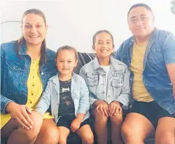  ?? Photo / NZME ?? Fire and Emergency NZ's Iwi liaison officer Albert Cash makes sure he and his two children Pounamu and Manawarang­i shower mum Alisha Takimoana with love and appreciati­on on Mother's Day.