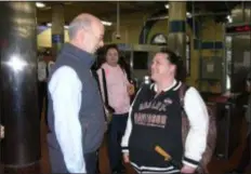  ?? KEVIN TUSTIN – DIGITAL FIRST MEDIA ?? Gov. Tom Wolf meets a voter during the morning rush at 69th Street Transporta­tion Center in Upper Darby Tuesday. Wolf was elected to a second term as governor in Tuesday’s elections.