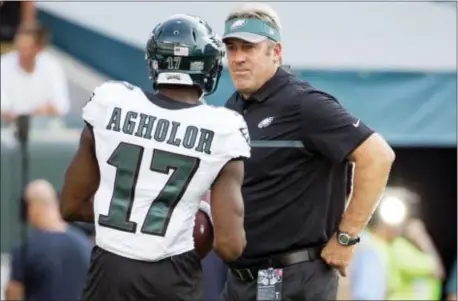  ?? ASSOCIATED PRESS FILE ?? Eagles head coach Doug Pederson benched wide receiver Nelson Agholor (17) for a game last season. But after an uncertain winter, the USC product appears to be on the upswing and is battling to be the starting slot receiver.