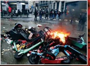  ?? ?? Mayhem: Even scooters were destroyed in Belgium’s capital