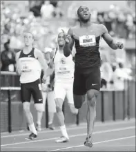  ?? By Robert Deutsch, USA TODAY ?? Blazing: LaShawn Merritt, right, wins the men’s 400 with the fastest time in the world this year. Bryshon Nellum, center, was third.