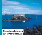  ??  ?? thorn island rises up out of Milford haven