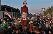  ?? KHALID MOHAMMED — THE ASSOCIATED PRESS FILE ?? Anti-government protesters hold an effigy of Iraqi Prime Minister Adel Abdel-Mahdi during ongoing protests in Baghdad, Iraq.