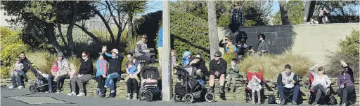  ?? PHOTOS: GERARD O’BRIEN ?? Stands full . . . Large groups of people lined the streets of Dunedin to watch more than 200 trucks pass in the Special Rigs for Special Kids convoy yesterday.