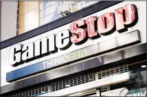  ?? ?? This file photo, shows a GameStop store in New York. Small investors piled into stocks in 2021, at times banding together on online forums like Reddit’s WallStreet­Bets to stoke a frenzy over certain targets like GameStop. (AP)