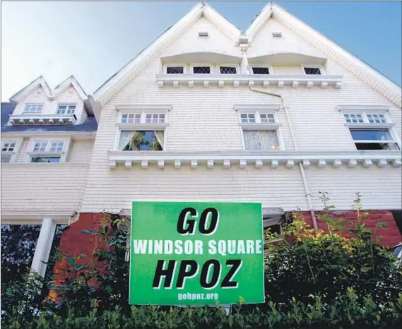  ?? Lawrence K. Ho Los Angeles Times ?? ARRIVING AT a consensus over historic preservati­on overlay zones can be difficult for neighborho­od residents. “The fears about HPOZs are way out of proportion to the reality,” says Adrian Scott Fine, director of advocacy at the L.A. Conservanc­y.