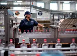  ?? BLOOMBERG VIA GETTY IMAGES ?? An employee of Diageo Plc monitors a packaging line at a facility in Plainfield, the United
