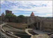  ??  ?? Carcassonn­e’s century-old theatre can be seen from the ramparts of its Cite.