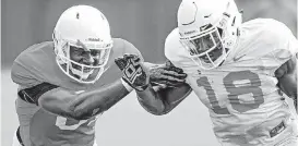  ?? CHRIS LANDSBERGE­R, THE OKLAHOMAN] [PHOTO BY ?? Oklahoma State receiver LC Greenwood, left, goes through a drill with defensive back Za’Carrius Green during a recent practice at the Sherman Smith Training Center.