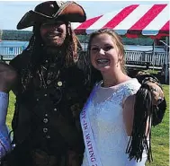  ?? DWIGHT PARKER ?? Dave Renshaw is seen holding a flogger, a type of whip, in this photo that triggered the latest round of bad blood between two rival pirate re-enactor groups.