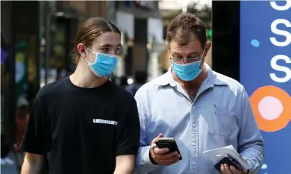  ?? Photograph: Lisa Maree Williams/Getty Images ?? Public health experts have called for restrictio­ns, such as masks and density limits, to combat the spread of the Omicron Covid variant.