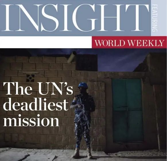  ?? JANE HAHN FOR THE WASHINGTON POST ?? A UN police officer stands guard in the city of Timbuktu, Mali. It’s the first significan­t UN peacekeepi­ng mission sent to help a state regain control over land contested by terrorist groups.