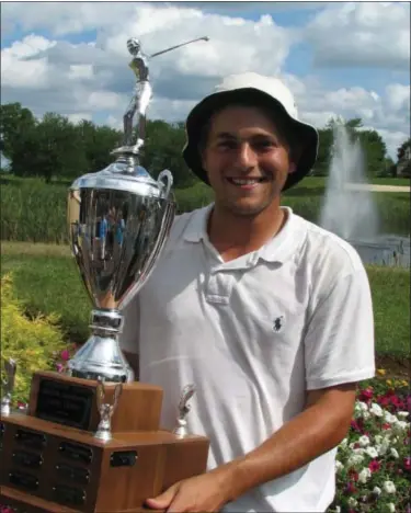  ?? Submitted Photo ?? Blue Bell’s Ben Feld holds Montgomery County Amateur Championsh­ip trophy after his successful defense of the title on Sunday.