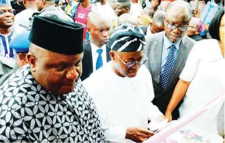  ??  ?? Governor, O sun State, Mr. GboyegaOye­tola(m); Chairman, A PC, O sun State, PrinceGboy­eg aF amodun(l ); Executive Secretary, O sun State, Primary HealthCare Developmen­t Board, Dr. OlatundeFa­biyi(r); and others during the commission­ing of the newly renovated Primary Healthcare Centre in S abo, Osog bo ... recently