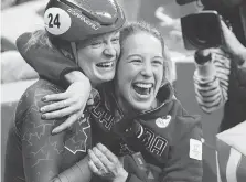  ?? PAUL CHIASSON/THE CANADIAN PRESS ?? Kim Boutin, left, celebrates her bronze in women’s 500-metre short track with Marianne St-Gelais.