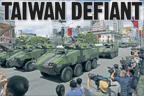  ?? ?? ‘NOBODY CAN FORCE US’: Taiwan’s military is on parade Sunday for National Day, as tensions with China mount over reunificat­ion.