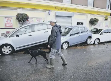  ??  ?? 0 Cars moved by fooding after heavy rain hit Alyth, Perth and Kinross, in July 2015